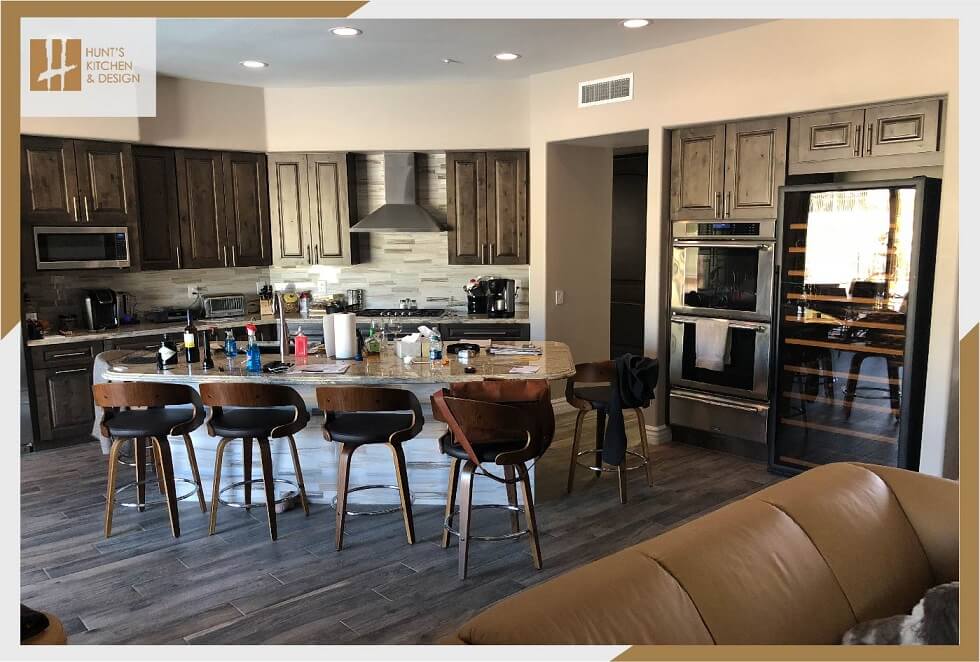 traditional kitchen in living room with island and chairs