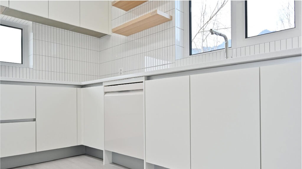 kitchen with white handleless cabinets