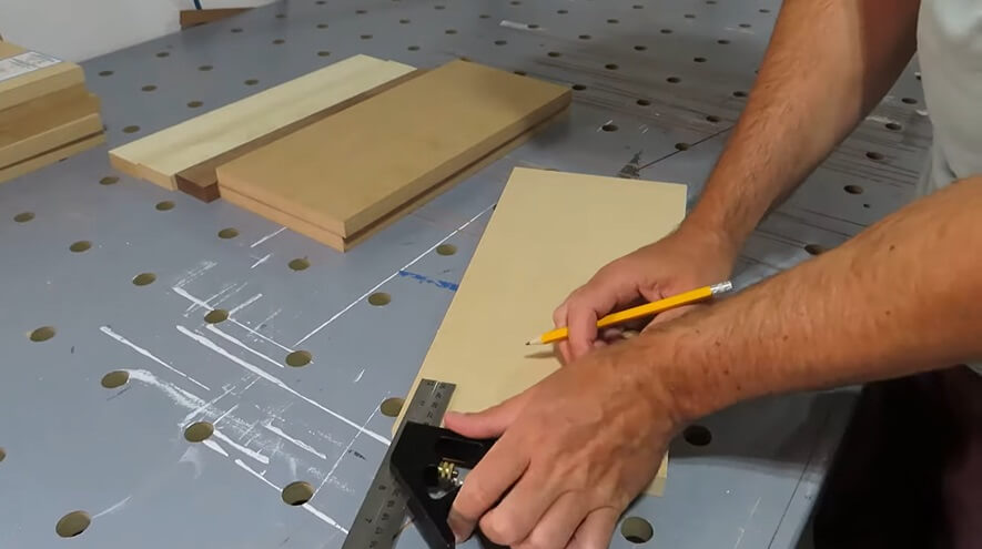 man making handleless cabinets DIY way