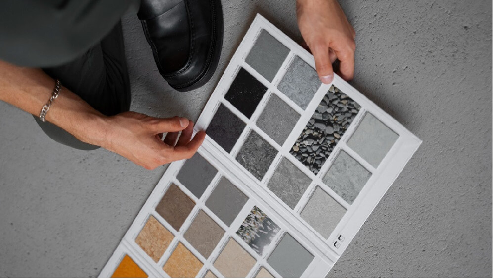 designer showing kitchen flooring samples