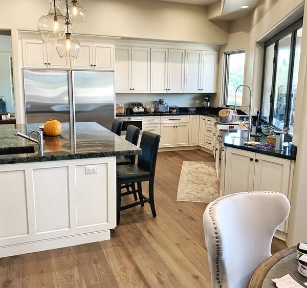 Transitional kitchen with island and chairs